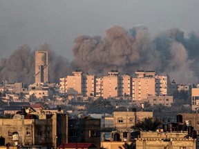 This picture taken from Rafah shows smoke billowing over Khan Yunis in the southern Gaza Strip during Israeli bombardment on January 16, 2024, amid ongoing battles between Israel and the Palestinian militant group Hamas.