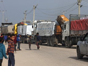 Trucks carrying humanitarian aid enter Rafah.