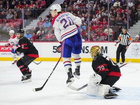 Canadiens' Juraj Slafkovsky jumps in front of Senators goalie Joonas Korpisalo during game in Ottawa Thursday night.