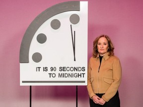 Rachel Bronson, president and CEO of the Bulletin of Atomic Scientists beside Doomsday Clock.