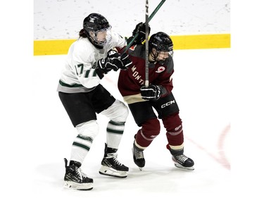 Boston Taylor Girard (17) puts pressure on Montreal Catherine Daoust (4) during the PWHL home opener at the Verdun Auditorium in Montreal on Saturday, Jan. 13, 2024.