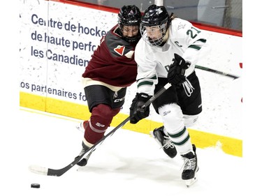 Montreal Catherine Daoust (4) pressures Boston Hilary Knight (21) during the PWHL home opener at the Verdun Auditorium in Montreal on Saturday, Jan. 13, 2024.