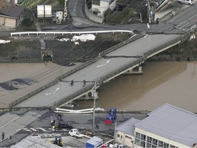Cracks are seen on a bridge following an earthquake in Suzu, Ishikawa prefecture, Japan Tuesday, Jan. 2, 2024.