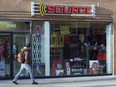 Best Buy Canada and Bell Canada have announced a partnership to rebrand and revamp 165 The Source stores. A man walks past The Source store in Toronto on Monday, March 2, 2009.