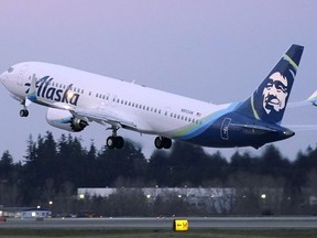 The first Alaska Airlines passenger flight on a Boeing 737-9 Max airplane takes off, Monday, March 1, 2021, on a flight to San Diego from Seattle-Tacoma International Airport in Seattle.&ampnbsp;Canadian airlines say they don't fly the Boeing 737-9 Max jetliners that U.S. regulators have grounded after an Alaska Airlines plane suffered a blowout in flight.