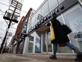 A person walks by a cannabis dispensary on Queen St. in Toronto, Monday, Jan. 6, 2020.