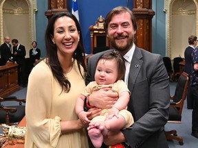 Marwah Rizqy and Gregory Kelley hold their baby in the National Assembly's Blue Room