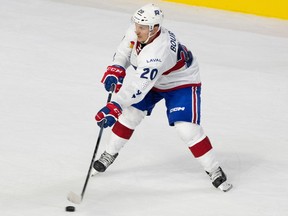 Rocket's Gabriel Bourque is seen carrying the puck on his stick.