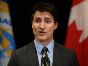 Prime Minister Justin Trudeau answers questions at a press conference following the signing of the Nunavut devolution agreement in Iqaluit, Thursday, Jan. 18, 2024.