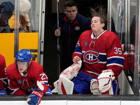 Canadiens goaltender Sam Montembeault is on the bench after he was replaced by Cayden Primeau during the third period against the Bruins on Saturday, Jan 20, 2024, in Boston.