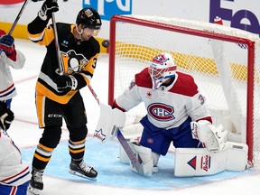 Pittsburgh Penguins' Colin White (36) cannot get his stick on a rebound off Montreal Canadiens goaltender Jake Allen (34) with Canadiens' Jayden Struble (47) defending in Pittsburgh on Saturday, Jan. 27, 2024.