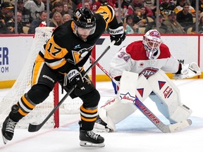 Penguins' Bryan Rust (17) cannot get his stick on a pass in front of Canadiens goaltender Jake Allen in Pittsburgh on Saturday, Jan. 27, 2024.