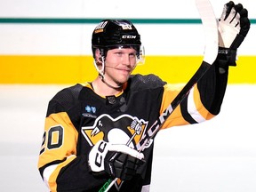 Penguins' Lars Eller waves to fans after being named the NHL hockey game's second star in Pittsburgh on Saturday, Jan. 27, 2024, against the Canadiens.