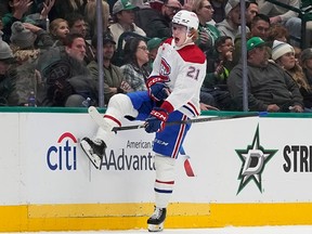 Montreal Canadiens defenseman Kaiden Guhle (21) celebrates a goal during the first period an NHL hockey game against the Dallas Stars