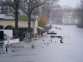 Footpaths and jetties on the banks of the river Trave are surrounded by floodwater in Luebeck, Germany, Wednesday, Jan. 3, 2024.