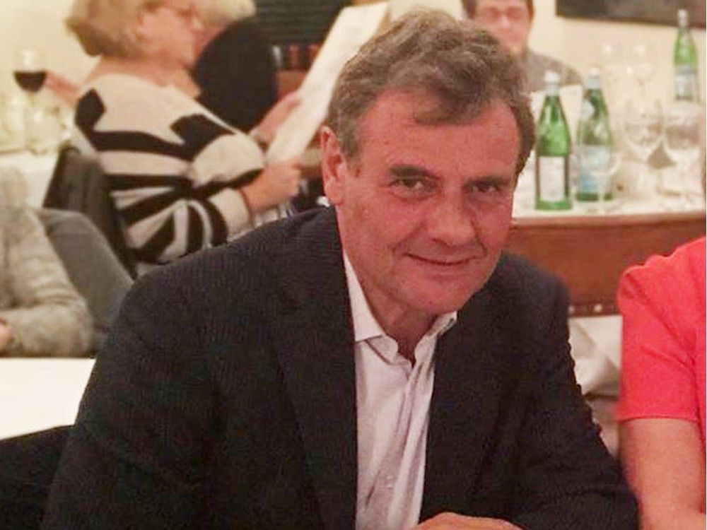 christophe folla sits at a restaurant table