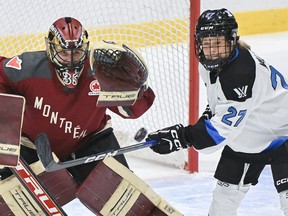 Toronto's Emma Maltais (27) tries to tip the puck past Montreal goaltender Ann-Renée Desbiens during first period PWHL hockey action in Montreal on Saturday, Jan. 20, 2024.
