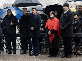 Prime Minister Justin Trudeau stands with Canada's Special Envoy on Preserving Holocaust Remembrance and Combatting Antisemitism Deborah Lyons, Ontario Minister of Education Stephen Lecce, Conservative MP for Leeds-Grenville-Thousand Islands and Rideau Lakes Michael Barrett and Conservative leader Pierre Poilievre stand during a service marking the 79th anniversary of the liberation of the Auschwitz-Birkenau concentration camp at the National Holocaust Memorial, in Ottawa, Friday, Jan. 26, 2024.