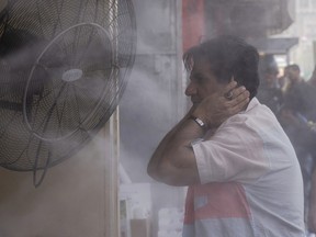 A man cools off during a heat wave in Baghdad, Iraq, July, 6, 2023.