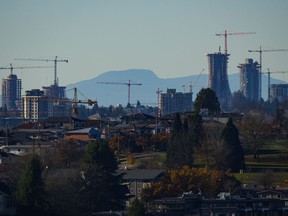 Construction cranes dot the skyline as condo towers are seen under construction at the Oakridge Park shopping centre redevelopment, in Vancouver, B.C., Thursday, Nov. 23, 2023.