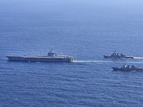 In this photo provided by South Korea's Joint Chiefs of Staff, the aircraft carrier USS Carl Vinson, left, sails with South Korean Navy's Aegis destroyer King Sejong the Great and Japan's Maritime Self-Defense Force Aegis destroyer Kongou in the international waters of the southern coast of Korean peninsular during a recent joint drill in 2024. The three countries conducted combined naval exercises involving the American aircraft carrier in their latest show of strength against nuclear-armed North Korea, South Korea's military said Wednesday, Jan. 17, as the three countries' senior diplomats were to meet in Seoul to discuss the deepening standoff with Pyongyang.