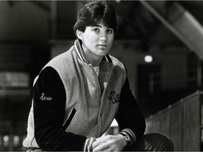 A young Mario Lemieux poses for a black-and-white photo wearing a jacket