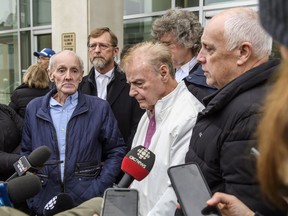 Robert Mailman, left, and Walter Gillespie, speak to media shortly after their hearing at Saint John Law Courts in Saint John, N.B., Jan. 4, 2024.