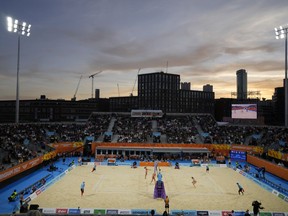 Alice Zeimann and Shaunna Polley of New Zealand play a return to Sarah Pavan and Melissa Humana-Paredes of Canada during the semifinal Beach Volleyball match between Canada and New Zealand.