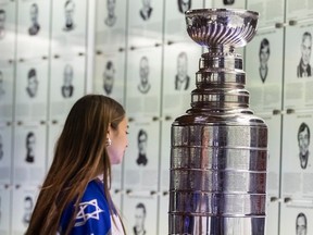 Israeli youth hockey player Liv Sharabi from the Canada Hockey Centre in Northern Israel looks at the Stanley Cup during a visit to the Hockey Hall of Fame in Toronto, Tuesday Jan, 23, 2024.