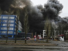 Smoke rises after a Russian attack in Kyiv, Ukraine, Tuesday, Jan. 2, 2024.