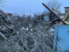 In this photo provided by the Ukrainian Emergency Service, a view of private houses damaged in a Russian missile attack, near Kryvyi Rih, Ukraine, Monday, Jan. 8, 2024.