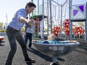 Prime Minister Justin Trudeau plays with his son Hadrien during a visit to Brampton, Ontario on Friday, Sept. 29, 2023.