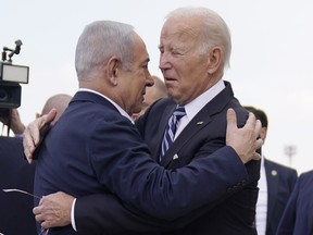 U.S. President Joe Biden is greeted by Israeli Prime Minister Benjamin Netanyahu after arriving at Ben Gurion International Airpor, on Oct. 18, 2023, in Tel Aviv.