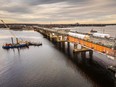 An aerial view shows a bridge undergoing construction work