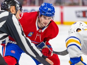 Canadiens' Sean Monahan lines up for a faceoff against the Sabres' Peyton Krebs during a game last month at the Bell Centre.