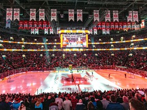 Players and fans stand for the national anthem before a Canadiens game at the Bell Centre last month.