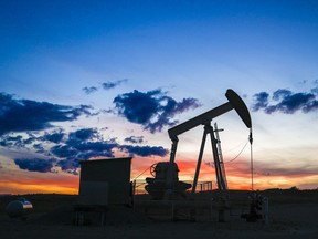 A pumpjack draws out oil from a well head near Calgary on Saturday, Sept. 17, 2022.