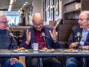 Brownstein, Lametti, Rand sit at diner table with microphones