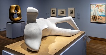 Henry Moore's Working Model for Oval With Points behind Moore's Thin Reclining Figure, 1979-1980 and Georgia O'Keeffe's Mule's Skill with Pink Poinsettias, 1936, to the right.
