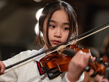 A girl plays violin.