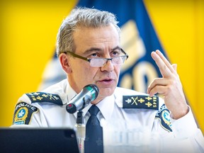 Montreal Police chief Fady Dagher holds his left index and middle fingers up during a press conference in Montreal.
