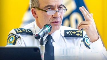 Montreal Police chief Fady Dagher holds his left index and middle fingers up during a press conference in Montreal.