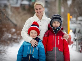 Victoria Nosenko is seen with sons Michael and Ioan, left, outside their home in the Rosemont district of Montreal on Friday, Feb. 16, 2024.