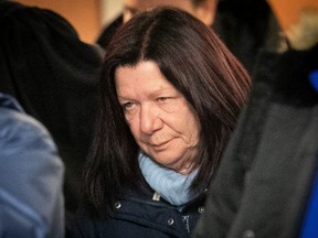 Photo of Sylvie Dagenais leaving the courtroom with her eyes downward.