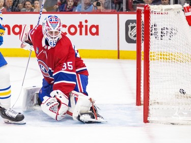 Montreal Canadiens' Sam Montembeault looks back at the goal with a puck in the net