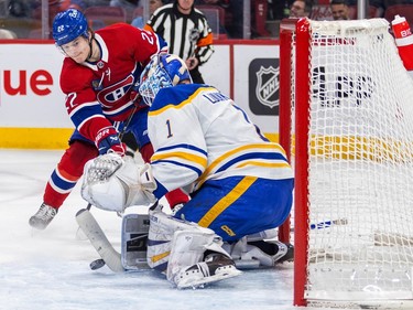 Montreal Canadiens' Cole Caufield takes a shot on Buffalo Sabres' Ukko-Pekka Luukkonen in front of the net