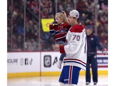 Canadiens' Tanner Pearson brings his daughter to the bench after a brief warm-up skate during the Canadiens' annual Skills Competition in Montreal on Sunday, Feb. 25, 2024.