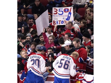 Fans crowd the boards to get autographs during the Canadiens' annual Skills Competition in Montreal on Sunday, Feb. 25, 2024.