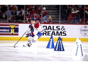 Canadiens' Juraj Slafkovsky rounds a pylon during the Canadiens' annual Skills Competition in Montreal on Sunday, Feb. 25, 2024.