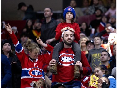 A young fan gets a booster for a better view during the Canadiens' annual Skills Competition in Montreal on Sunday, Feb. 25, 2024.